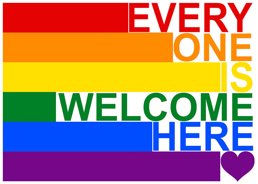 text reading "everyone is welcome here" in rainbow colors